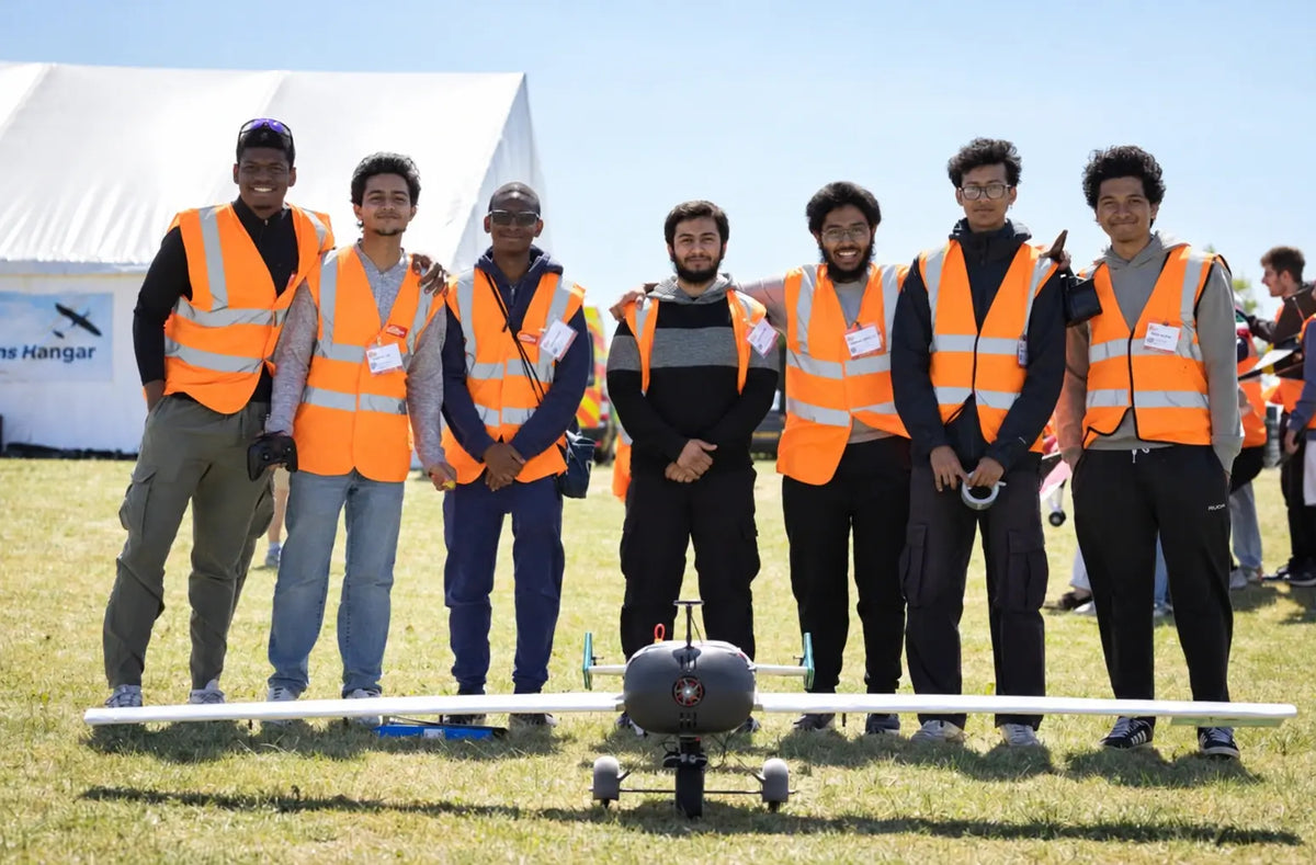 University of Leicester AeroLabs team members standing behind their competition aircraft.